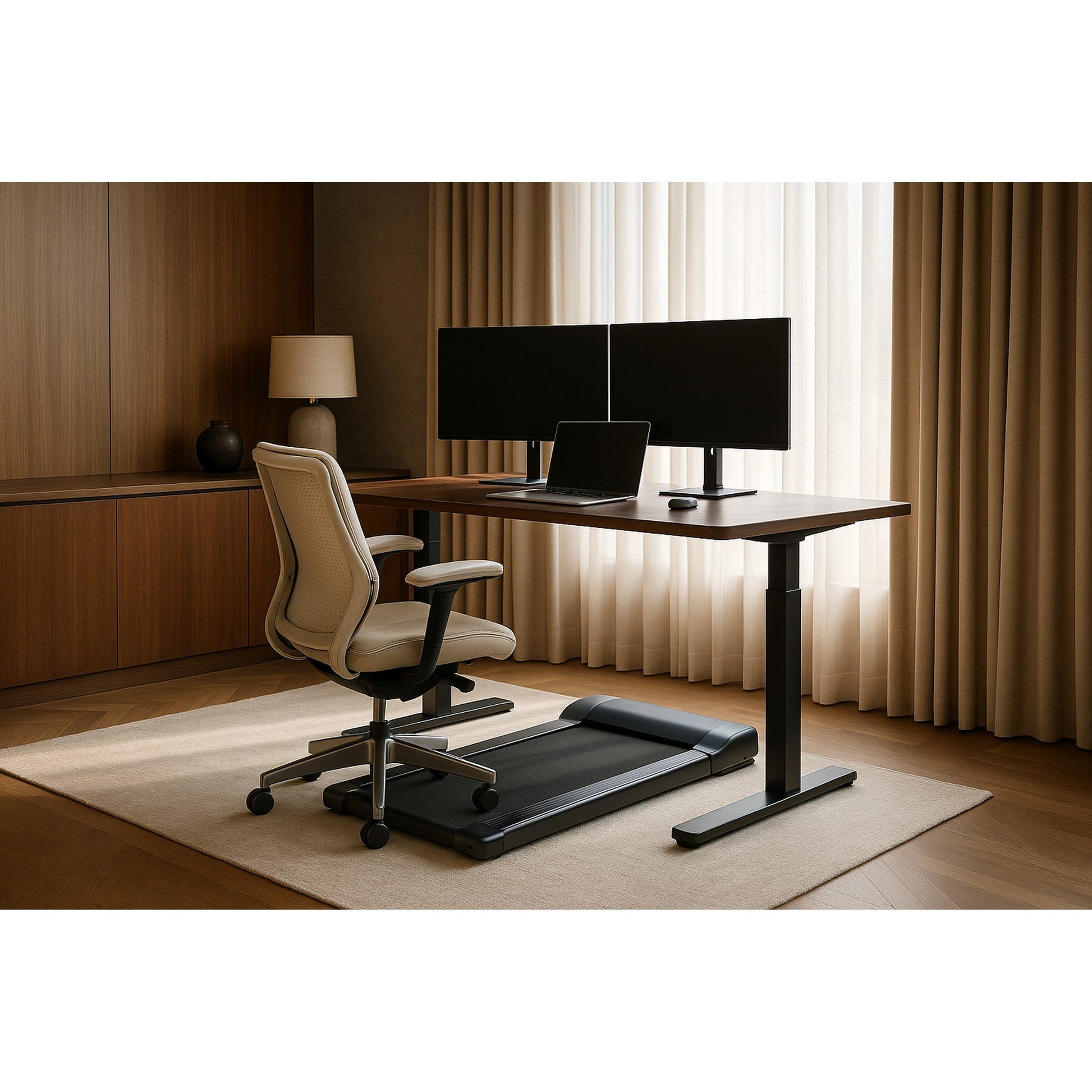 Modern office setup with a standing desk, chair, dual monitors and AV under desk treadmill (walking pad).